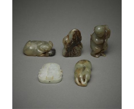Group of five Chinese jade carvings including:One monkey clutching to a vine or branch, with inclusions shading the side of t