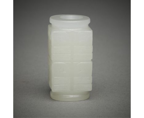 Small Chinese carved pale jade cong. Each side carved with a two-tiered geometric design. Of square form with circular upper 
