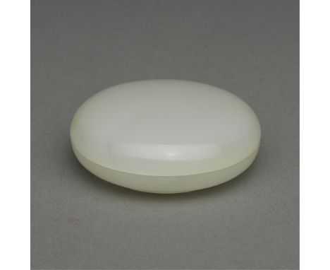Chinese carved jade paste box. Of round form carved from a white jade. With an incised mark along the underside, reading "Che