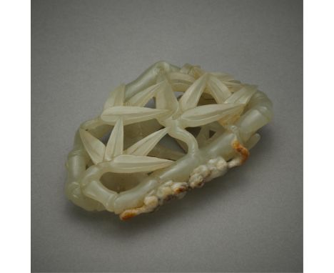 20th century Chinese jade carving depicting a cluster of bamboo with two small creatures touching snouts. With delicately pie