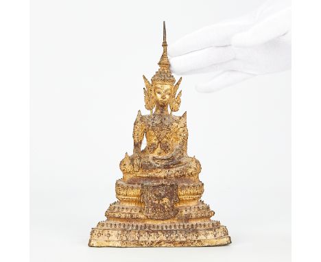 A lovely antique Thai gilt bronze buddha.Height: 9 in x width: 5 3/4 in x depth: 3 in.Condition: There are no major bends, br