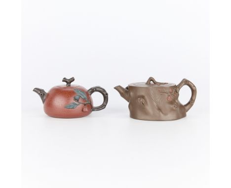 Group of two Chinese Yixing zisha clay teapots. The natural form teapot is of a brown and irregular cylindrical form depictin