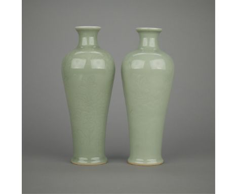 Pair of Chinese Qing porcelain vases with a celadon glaze and incised floral decoration. Drilled, marked under the drill hole