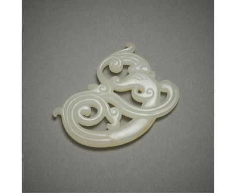 Chinese carved jade pendant or plaque. Of a lovely pale jade in the form of curling scrollwork surmounted by a phoenix head. 