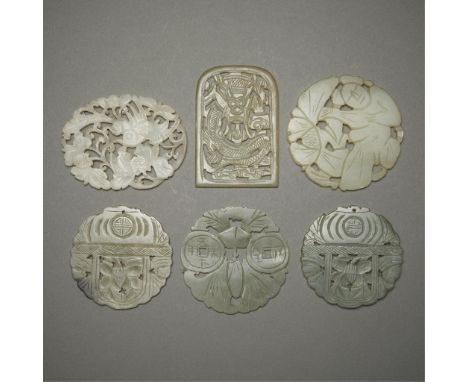 Group of six Chinese carved jade and carnelian plaques. Including depictions of a dragon, a phoenix, a figure, and shou symbo