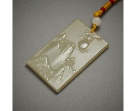 Chinese 20th century celadon carved jade pendant depicting a vast and serene mountain scene with a sun or moon overlooking a 