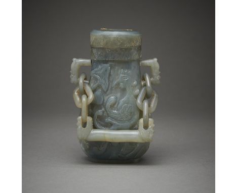 Chinese jade vessel carved along one side with a phoenix and the other side with bamboo. With two applied mask-form handles, 