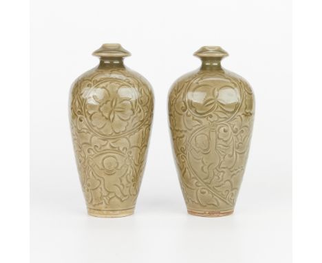 Pair of 20th century Chinese Yaozhou style porcelain vases with a celadon glaze. The sides decorated with carved depictions o