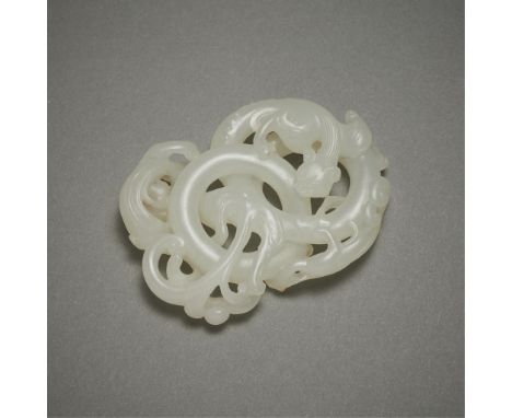 Chinese carved pale jade depicting three intertwined dragons surrounding two linked circles. Of a lovely pale jade with intri