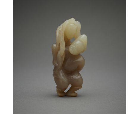 Chinese carved figural group depicting a figure carrying another on their back. The body of a pale brown coloration, the head