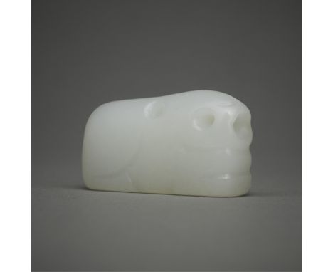 Chinese carved white jade bead in the form of a rabbit. With simple lines that suggest the form of the animal.Included in thi