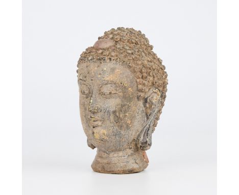 Chinese 17th century bronze Buddha head with red ushnisha. With partial wax Chinese export seal.Height: 6 1/2 in x width: 4 3