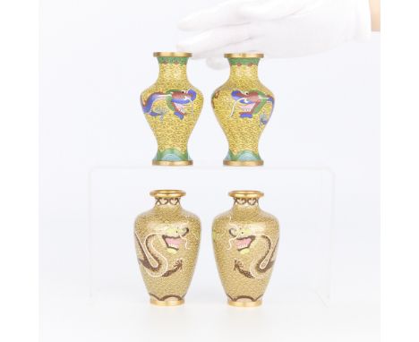 Two pairs of small Chinese cloisonne vases, four total. All with a yellow ground and depicting dragons wrapping around, late 