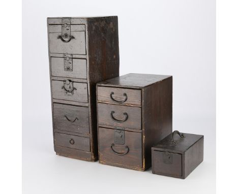 Group of three Japanese lacquered wooden tansu, strong boxes, or campaign chests, 19th century. The largest has five drawers 