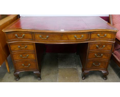 A Chippendale style mahogany and red leather topped library desk 