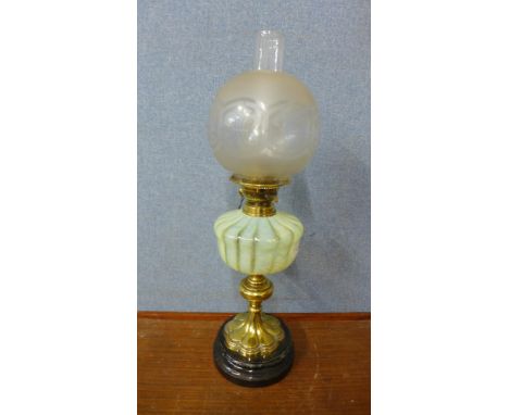 A Victorian brass oil lamp, with Vaseline glass reservoir 