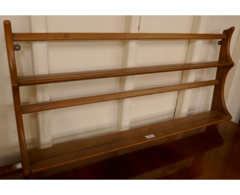 An Ercol Blonde elm wall hanging plate rack 