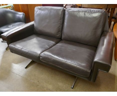 A Danish Stouby black leather two seater sofa 