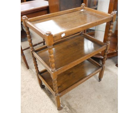 An oak bobbin turned trolley 