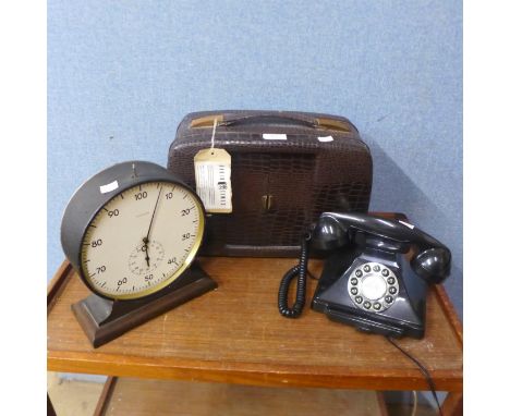 A vintage radio, a mantel clock and a telephone 