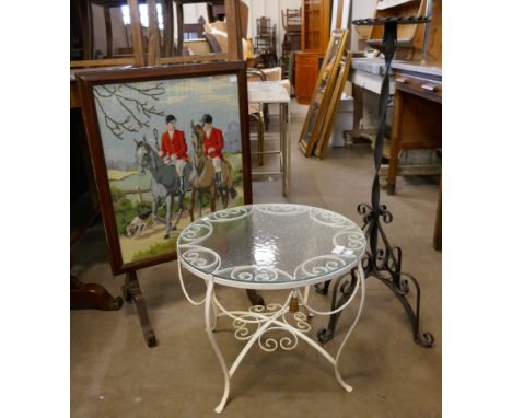 A wrought iron and glass topped table, a tapestry firescreen and a metal plant stand 