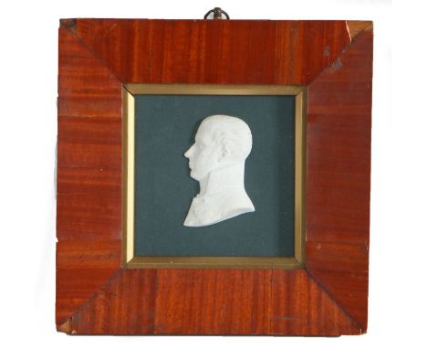 Early 19th Century biscuit ware profile portrait of a Flemish nobleman, signed, housed in a glazed mahogany frame, the portra
