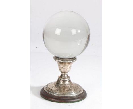 A crystal ball on associated silver and wood stand, Henry Clifford Davis, Birmingham, 1886, possibly converted from candlesti