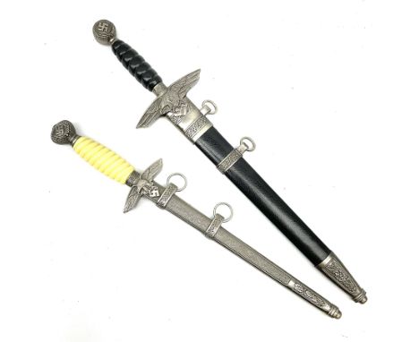 Two reproduction WW2 German daggers - Luftwaffe officer's first pattern; and Luftwaffe officer's second pattern; each with sc