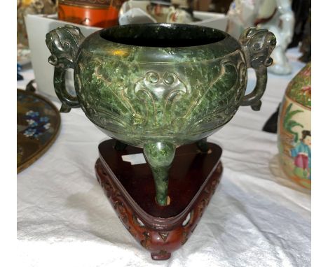 A cauldron censor in spinach jade coloured soapstone, with elephant mask handles and relief decoration, on 3 feet with stand,