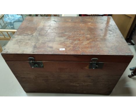 A large stained wood trunk 