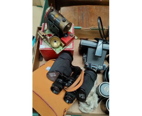 A spirit driven stationary steam engine by Bowman; a pair of binoculars; a Polaroid camera 