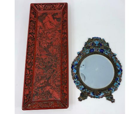 A cloisonne framed Chinese mirror decorated with sea horses etc and a cinnabar coloured tray Enamel laid over not cloisonne, 