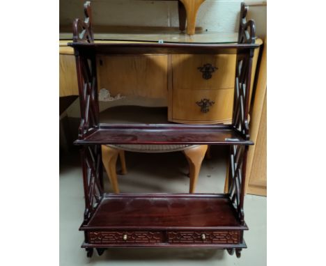 A mahogany 3 tier wall shelf unit in the Chippendale style with lattice side, 2 drawers to lower shelf 