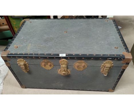 A vintage metal bound steamer trunk 
