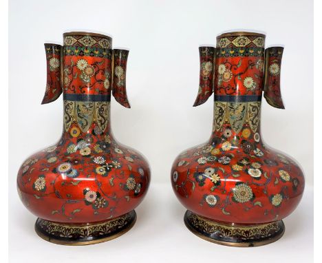 A late 19th/early 20th century Japanese pair of cloisonné vases of compressed onion form with tall slender necks, simulated a