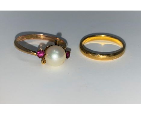 A 22 carat hallmarked gold wedding ring, 2.5 gm; a pearl and ruby set ring, stamped '14k' 