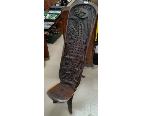 An African tribal carved 2 piece chair; a candlestick; carved ethnic items 
