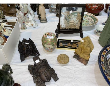 A carved soapstone Buddha figure; 2 oriental carved wood heads; a polished stone small trinket box; a Chinese covered jar, fa