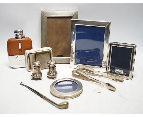 A collection of white metal and hallmarked silver to include three photo frames, a mounted glass flask, a compact, a lipstick