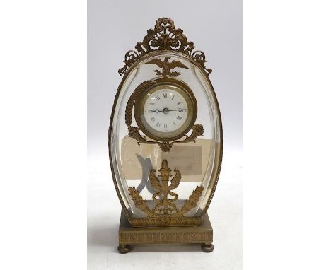 A French decorative oval shaped glass and gilt mounted mantel clock, 23cm high. Condition - good, unchecked if workingGlasses