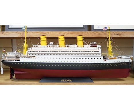 A modern Marklin clockwork tinplate ocean liner, 'Viktoria', on stand,  hull 98cm long. Condition - fair, some losses and wea