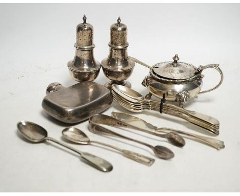 A collection of small silver to include two pepper pots, a mustard pot, a small hip flask, a pair of sugar tongs, a set of fi