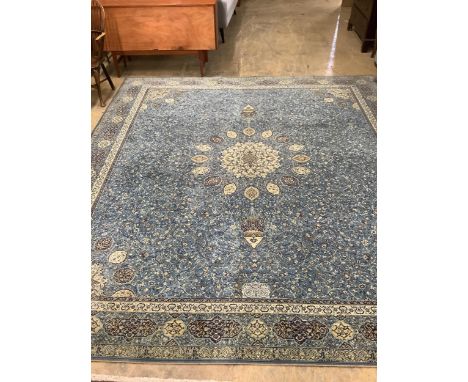 A Wilton Kashmir style machined blue ground carpet, 364 x 320cm. Condition - good