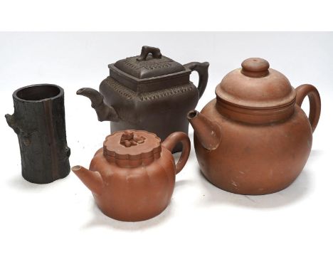 A 19th century Chinese Yixing pottery ‘tree trunk’ brush pot and three similar teapots, tallest 15cm. Condition - fair to goo