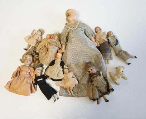 Eleven doll's house dolls, 19th and early 20th century, including two Kammer &amp; Reinhardt bisque jointed dolls and a wax o