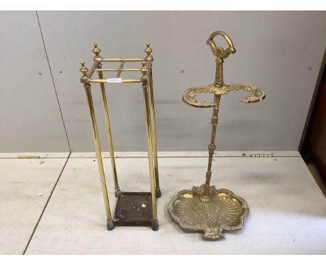 An early 20th century brass and cast iron four division stick stand, height 68cm, together with a reproduction brass stick st