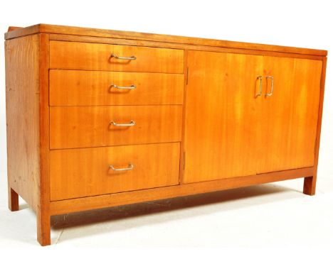 A retro vintage circa 1960's Air Ministry teak sideboard credenza with 4 graduating drawers to the left and double cupboard t