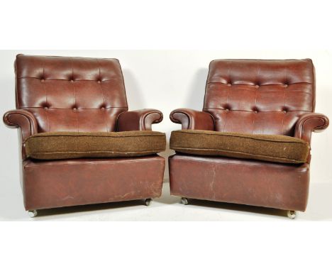 A pair of vintage retro mid 20th century circa 1970’s Parker Knoll armchairs / easy chairs. The chairs having brown leatheret