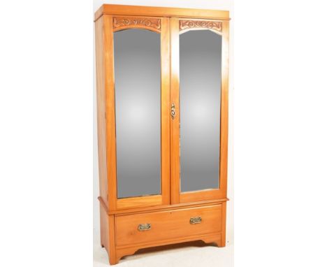 An early 20th century Edwardian satin walnut armoire / single wardrobe. The wardrobe having twin bevelled glass mirror doors 