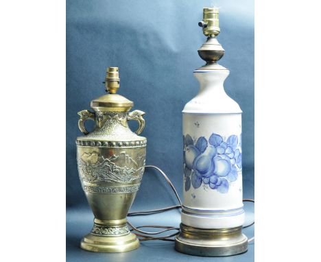 A vintage 20th century Chinese brass lamp shade having embossed decoration together with a ceramic lampshade of cylindrical f
